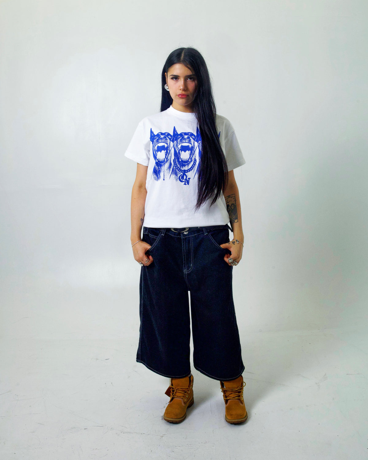 Model wearing the 3 Headed Dog Tee in white from Collection X