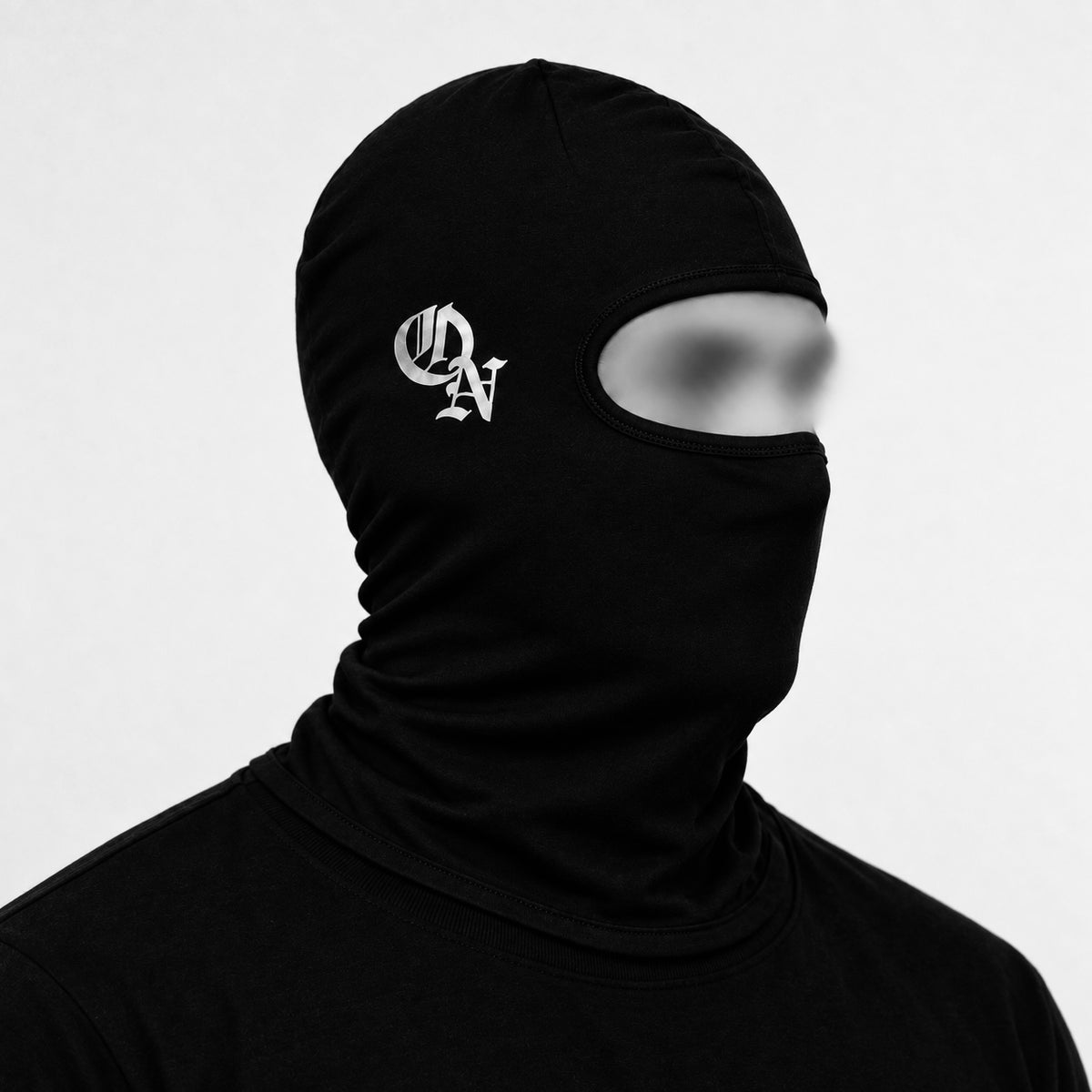 Black balaclava worn, showing the reflective ON logo on the side of the head